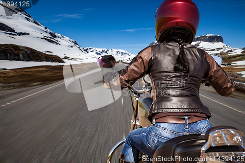 Image of Biker girl First-person view, mountain serpentine.