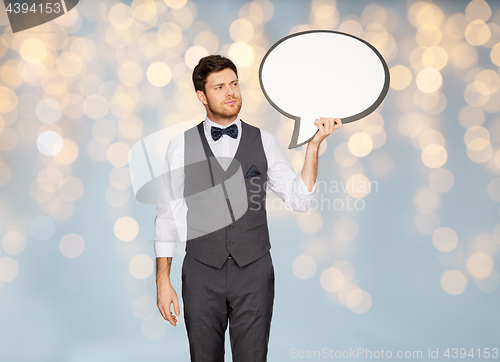 Image of man in suit holding blank text bubble banner