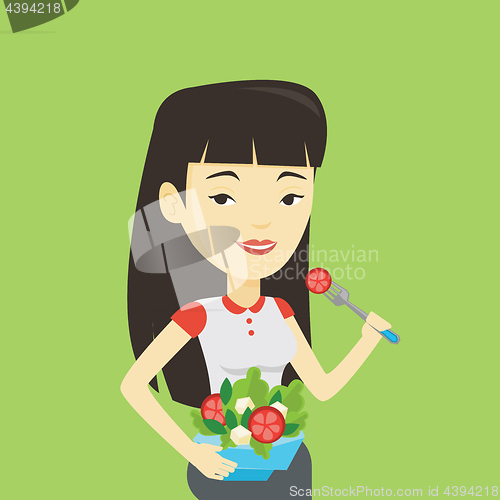 Image of Woman eating healthy vegetable salad.