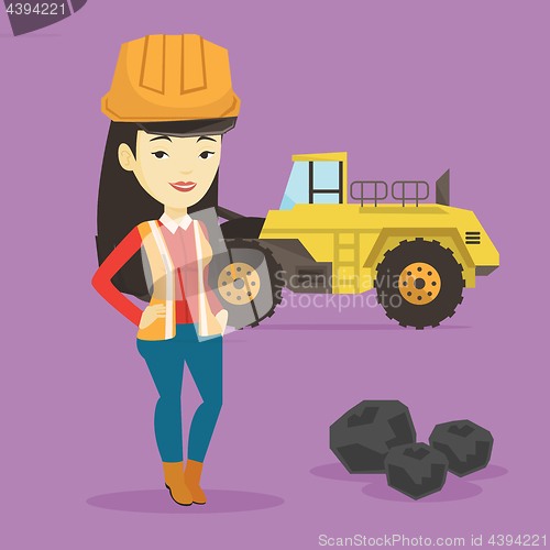 Image of Miner with a big excavator on background.