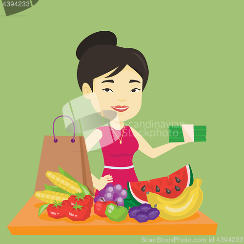 Image of Woman standing at the table with shopping bag.