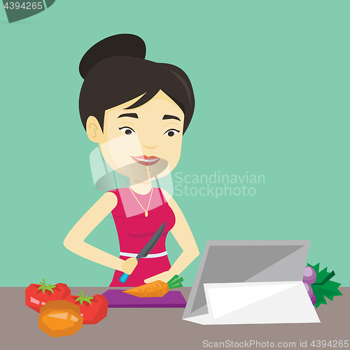 Image of Woman cooking healthy vegetable salad.