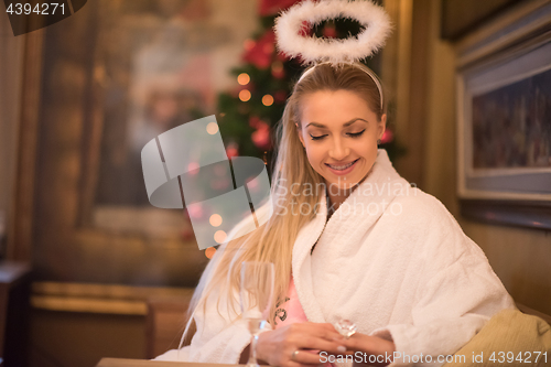 Image of woman drinking champagne at spa