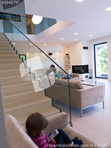 Image of family with little girl enjoys in the modern living room