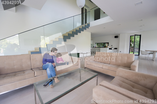 Image of mother and her cute little daughter are using a tablet