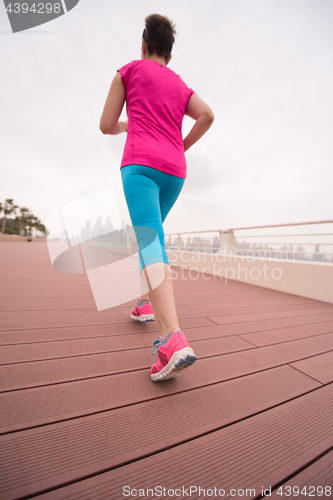 Image of woman running on the promenade