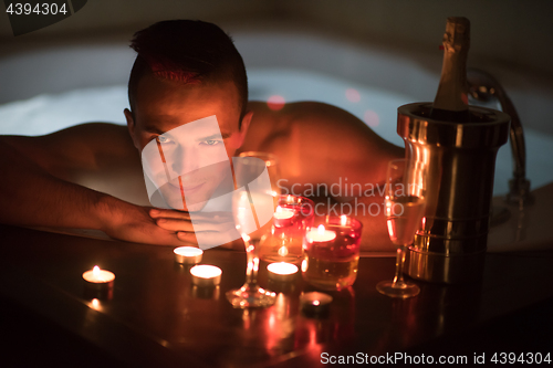 Image of man relaxing in the jacuzzi