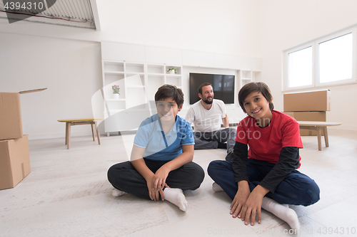 Image of portrait of happy young boys with their dad