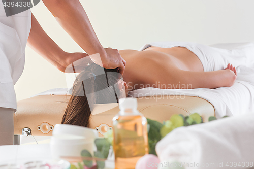 Image of The picture of beautiful woman in massage salon