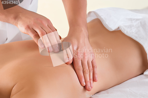 Image of The picture of beautiful woman in massage salon