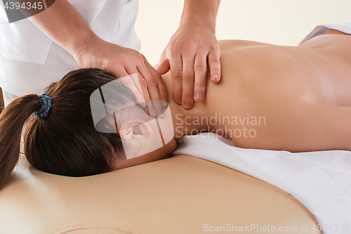 Image of The picture of beautiful woman in massage salon