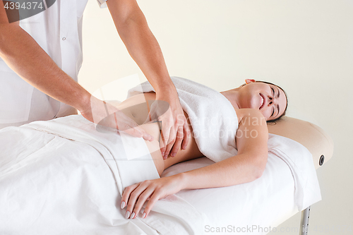 Image of The picture of beautiful woman in massage salon