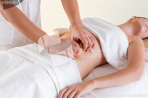 Image of The picture of beautiful woman in massage salon