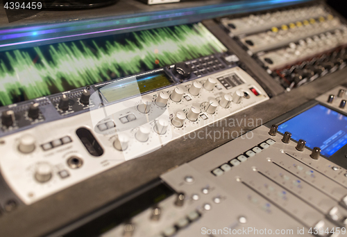 Image of music mixing console at sound recording studio