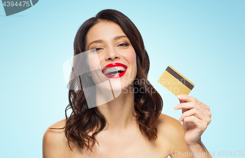 Image of beautiful woman with red lipstick and credit card