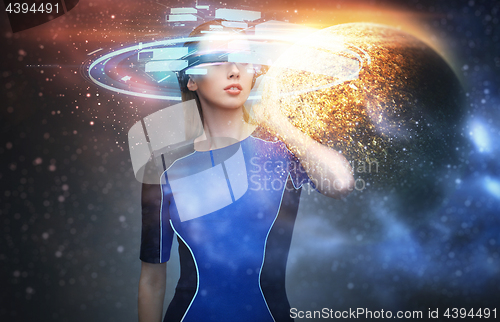 Image of woman in virtual reality glasses over space