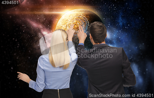 Image of businessman and businesswoman over space