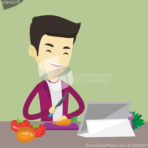 Image of Man cooking healthy vegetable salad.