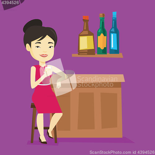 Image of Smiling woman sitting at the bar counter.