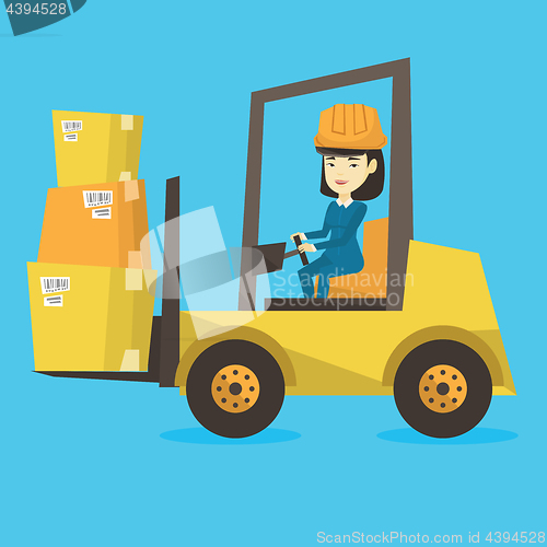 Image of Warehouse worker moving load by forklift truck.