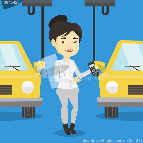 Image of Worker controlling automated assembly line for car