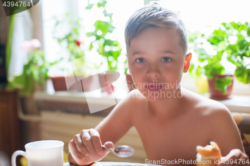 Image of Cute boy ready for breakfast