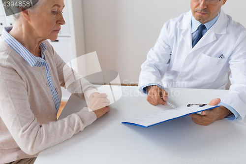 Image of senior woman and doctor meeting at hospital