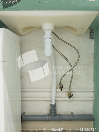 Image of Flexible connection of cold and hot water and a wash-basin siphon
