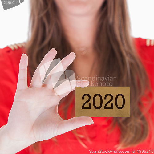 Image of Woman showing a business card - 2020