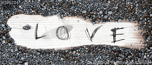 Image of Sand on planked wood - Love