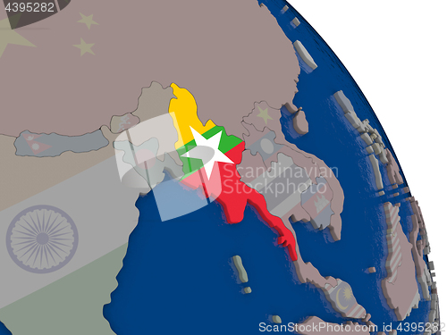 Image of Myanmar with flag on globe