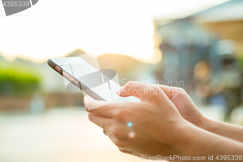 Image of Woman using cellphone