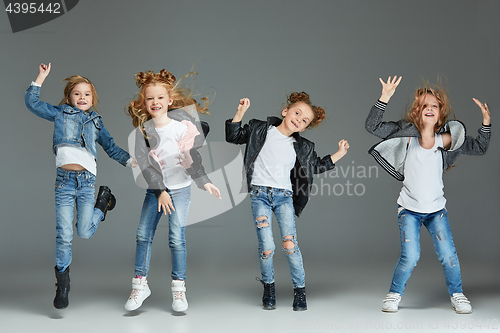 Image of Young girl jumping at studio