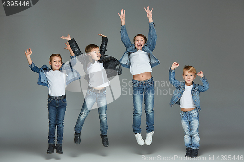 Image of Young boys jumping at studio