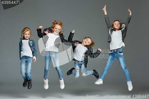 Image of Young girl jumping at studio
