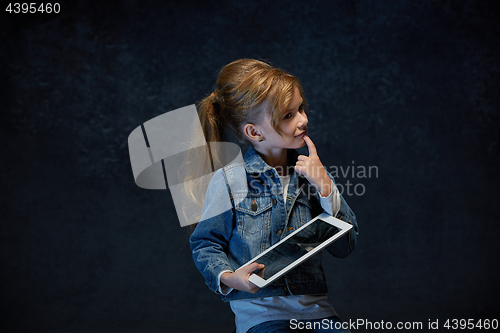 Image of Little girl sitting with tablet