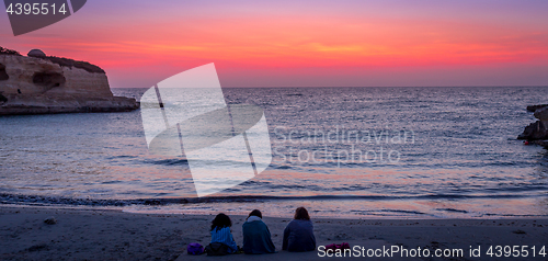 Image of Three friends looking to the sunrise