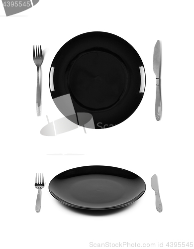 Image of Black plate with fork and knife