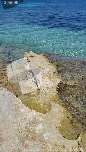 Image of Bright turquoise sea water and coastal rocks