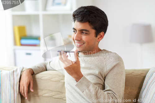 Image of man using voice command recorder on smartphone