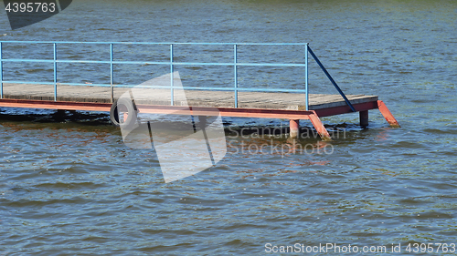 Image of Old wooden pier in a fine sunny day