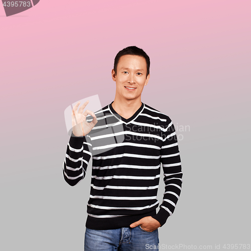 Image of Asian Man In Striped Pullover