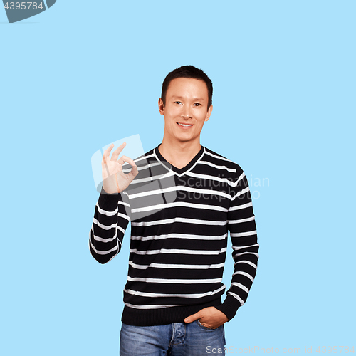 Image of Asian Man In Striped Pullover