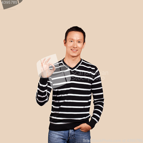 Image of Asian Man In Striped Pullover