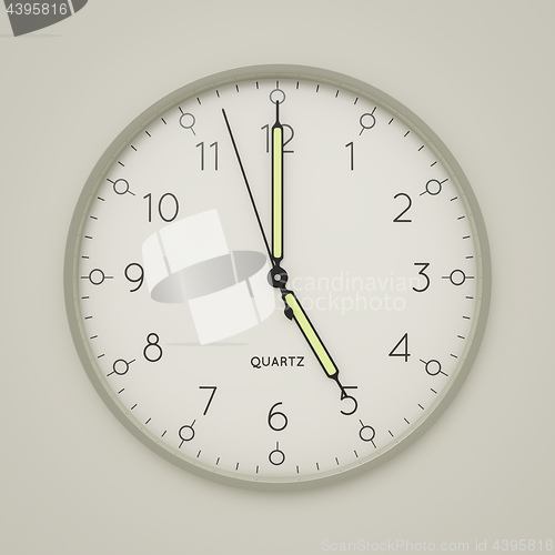 Image of a clock shows 5 o\'clock