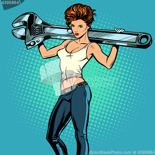 Image of Beautiful woman with a wrench