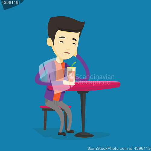 Image of Man drinking cocktail at the bar.