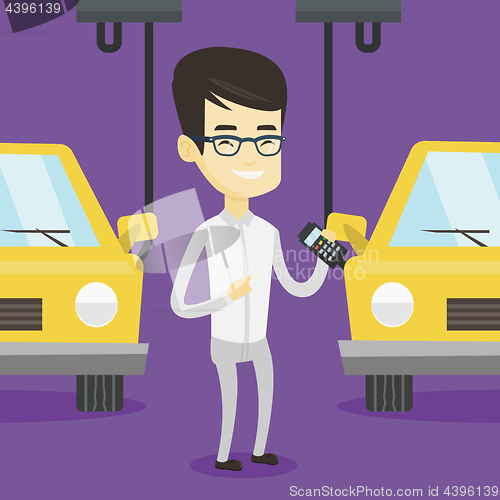 Image of Worker controlling automated assembly line for car