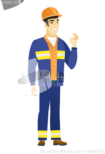 Image of Smiling builder showing ok sign.