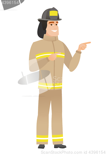 Image of Young caucasian firefighter pointing to the side.